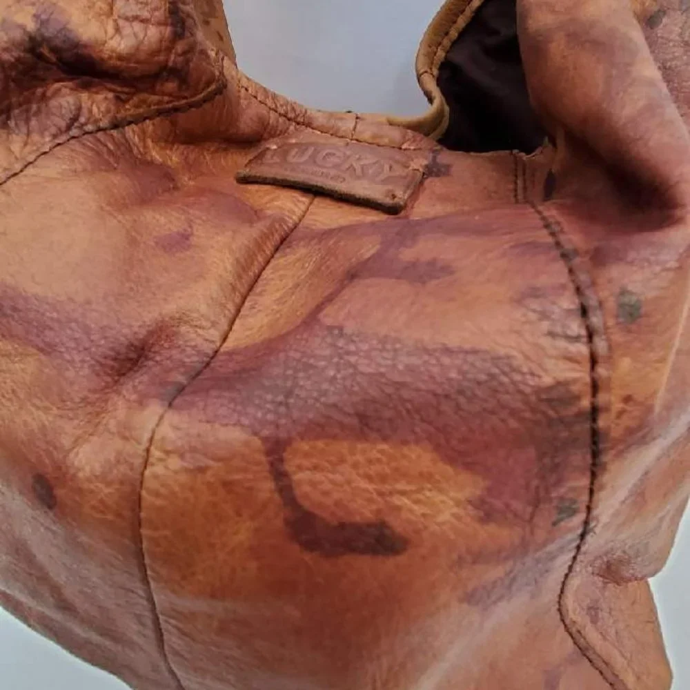Brown tan black leather lucky hobo boho cowgirl western rodeo equestrian hippie